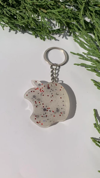 Sedefli Beyaz İçinde Siyah Kırmızı Glitterli Apple Elma Şekil Gümüş Aksesuarlı Anahtarlık El Yapımı ürün görseli 1
