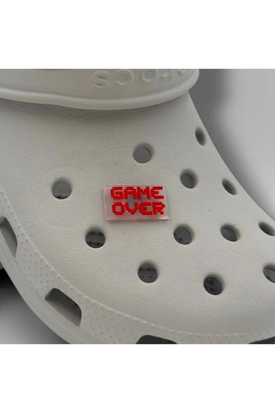Crocs Terlik Süsü ve Aksesuarı , Çanta Süsü – Jibbitz 3D Game Over Yazısı Şeffaf Zemin Logo Aksesuar ürün görseli 1