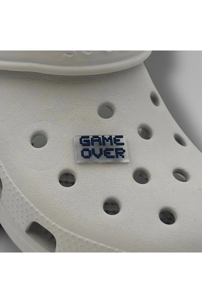 Crocs Terlik Süsü ve Aksesuarı , Çanta Süsü – Jibbitz 3D Game Over Yazısı Şeffaf Zemin Logo Aksesuar ürün görseli 1