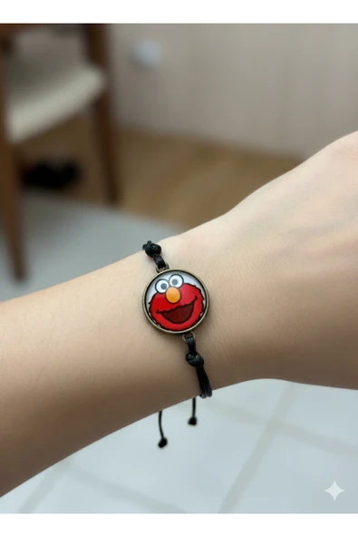 Susam Sokağı Turuncu Elmo Figürlü Ayarlanabilir Siyah İp Bileklik – Unisex Sevimli Tasarım ürün görseli 1