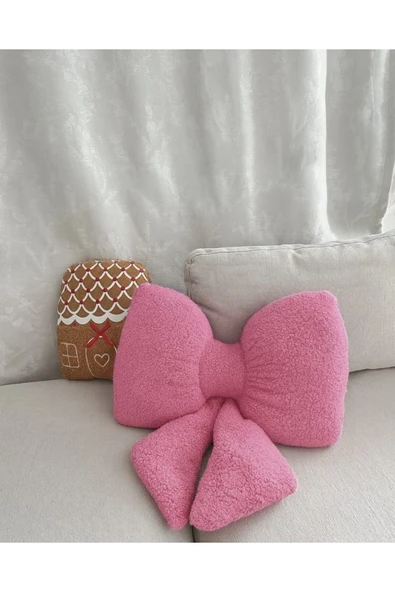 Yastıkland PEMBE PELUŞ KURDELE ŞEKLİNDE DEKORATİF KÜÇÜK YASTIK (35x20 ölçülerinde) ürün görseli 1