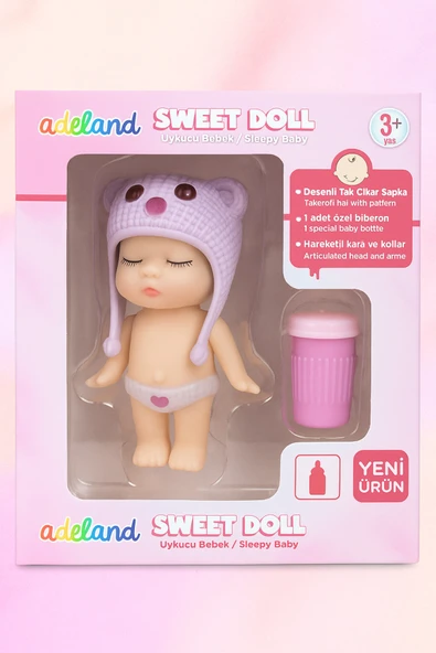 Adeland Sweet Doll Uykucu Bebek 10 cm – Kutu 14×10×5 cm (Lila Şapka - Düğme Göz) ürün görseli 1