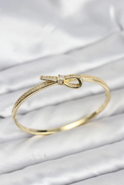Pirinç Gold Renk Zirkon Taşlı Fiyonk Model Kadın Kelepçe Bileklik 5886 ürün görseli 1