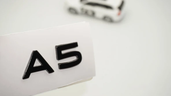 DK Tuning A5 2025+ Yeni Nesil Bagaj Siyah Yazı Logo Arma Audi İle Uyumlu ürün görseli 1