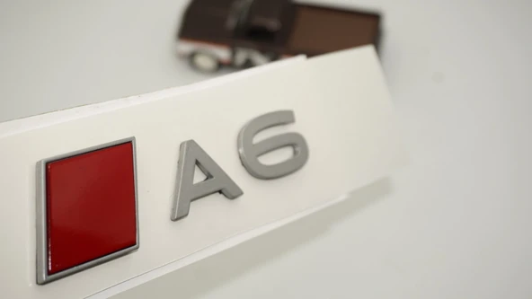 DK Tuning A6 2025+ Bagaj Gümüş Kırmızı Yazı Logo Arma Audi İle Uyumlu ürün görseli 1