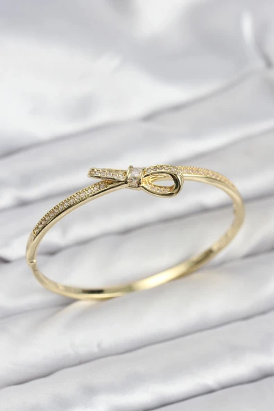 Pirinç Gold Renk Zirkon Taşlı Fiyonk Model Kadın Kelepçe Bileklik ürün görseli 1