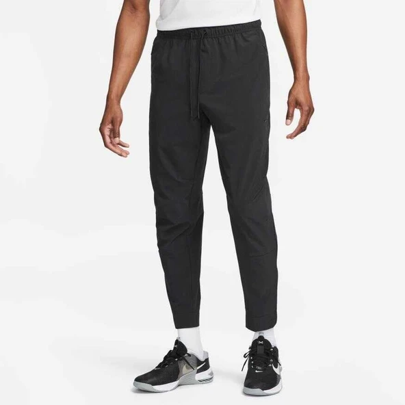 M NK DF UNLIMITED PANT TPR  Erkek Eşofman Alt FB7548-010 ürün görseli 1