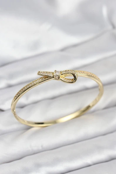 Pirinç Gold Renk Zirkon Taşlı Fiyonk Model Kadın Kelepçe Bileklik ürün görseli 1