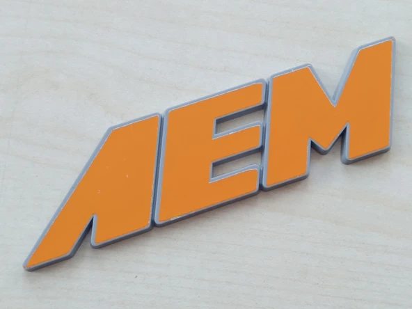 AEM YAZISI 10x2,5cm KABARTMA SPORT ARMA TURUNCU (AEM ARMASI) AEM LOGOSU ürün görseli 1